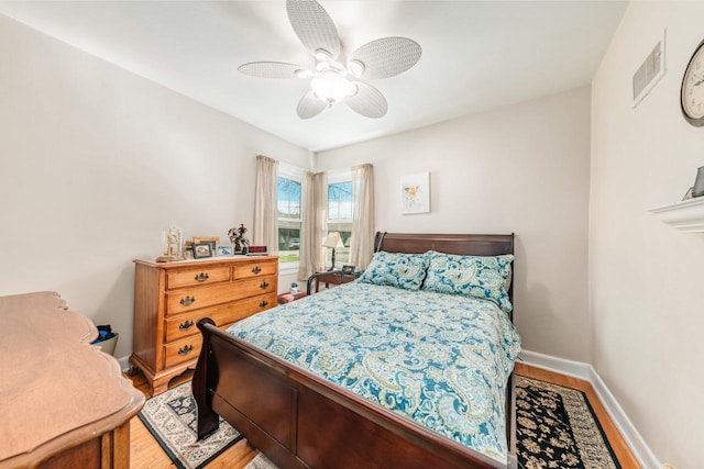 556 Gold St, Green Lake, WI 54941 - bedroom with light wood finished floors, baseboards, and ceiling fan