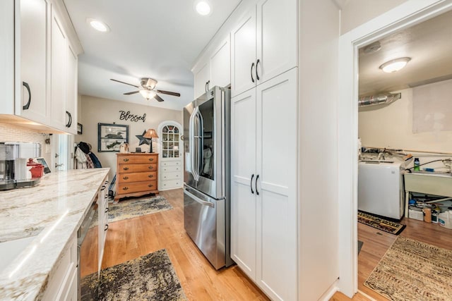 556 Gold St, Green Lake, WI 54941 - kitchen with appliances with stainless steel finishes, white cabinets, light wood-style floors, and recessed lighting