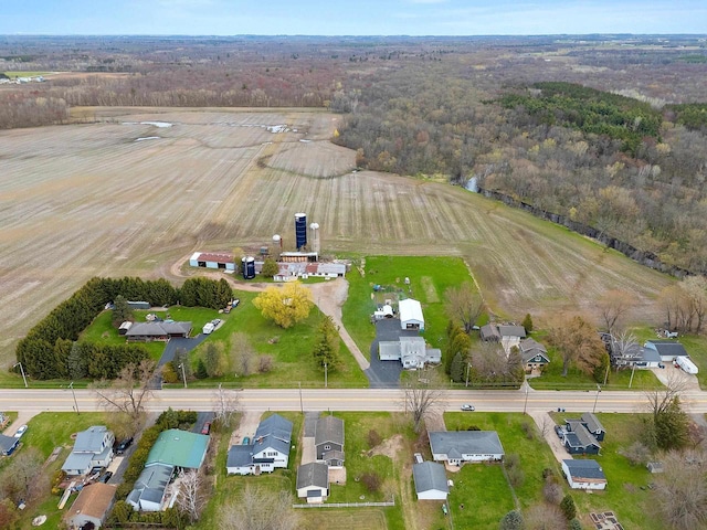 aerial view with a wooded view and a rural view