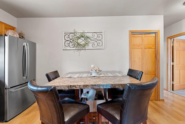 dining room featuring light wood finished floors