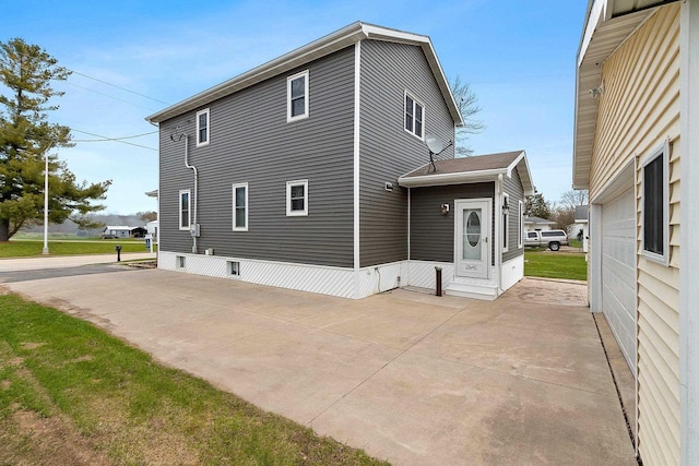 view of side of property featuring a patio area