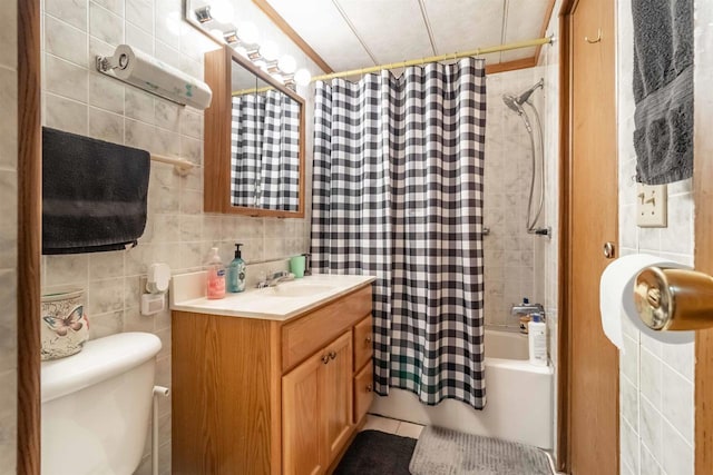 976 Blackhawk Ct, Hancock, WI 54943 - full bath featuring vanity, toilet, shower / tub combo, and tile walls