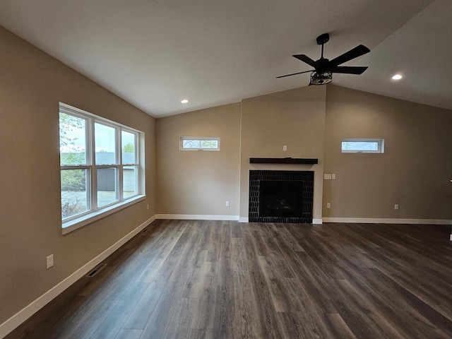 unfurnished living room with a fireplace, dark wood finished floors, a ceiling fan, baseboards, and lofted ceiling