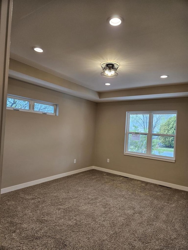 spare room with baseboards, carpet, and recessed lighting