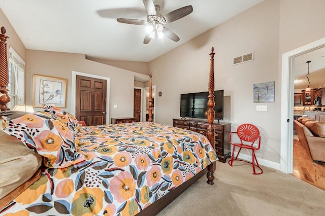 carpeted bedroom with a ceiling fan, baseboards, visible vents, and lofted ceiling
