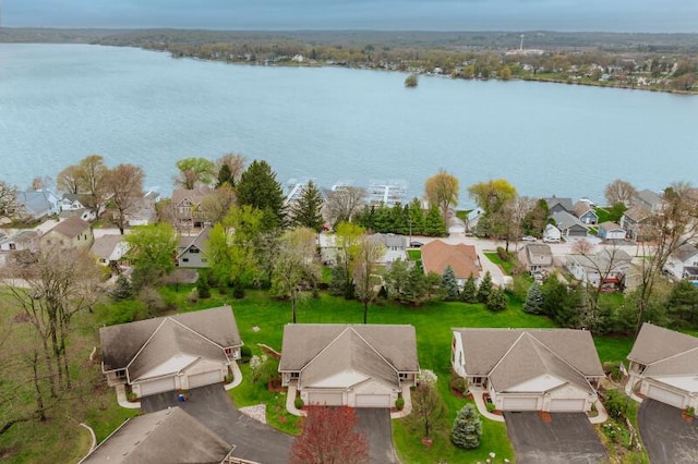 bird's eye view with a water view and a residential view
