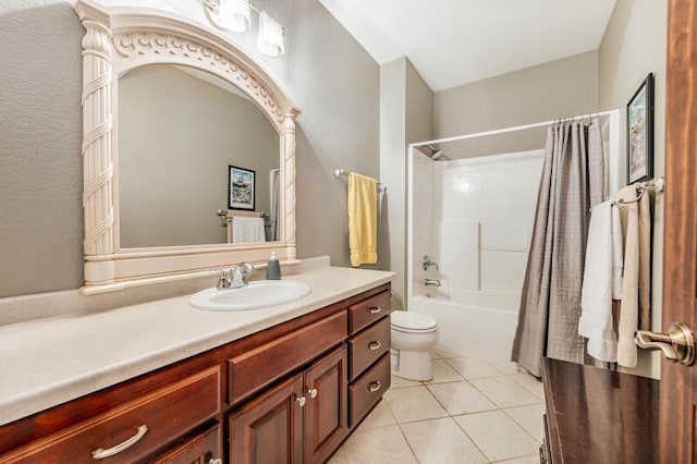 bathroom with vanity, tile patterned flooring, toilet, and shower / tub combo
