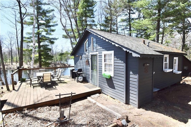 view of outbuilding featuring outdoor dining area