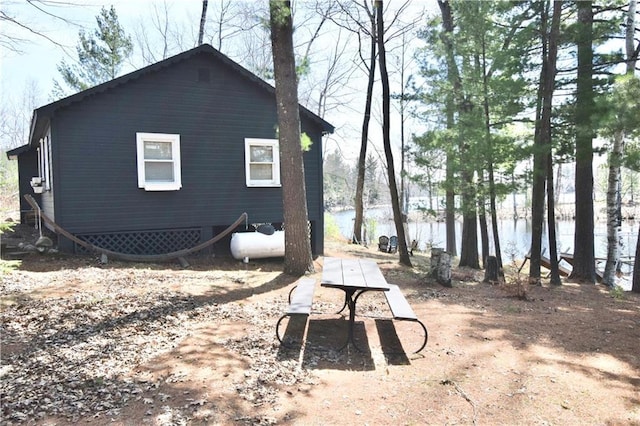 rear view of house with a water view