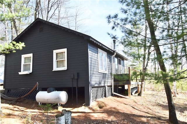 view of side of property with a wooden deck