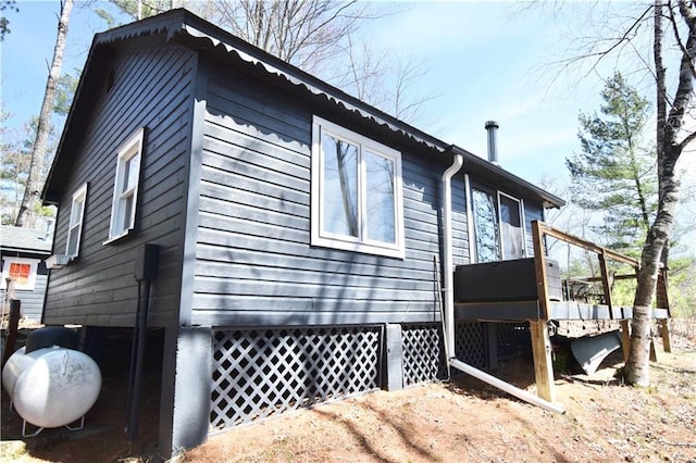 view of home's exterior featuring a deck