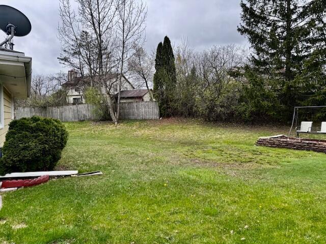 view of yard with fence