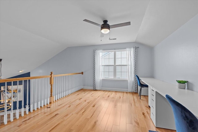 630 Polaris St, West Bend, WI 53095 - additional living space with ceiling fan, visible vents, vaulted ceiling, wood finished floors, and built in study area