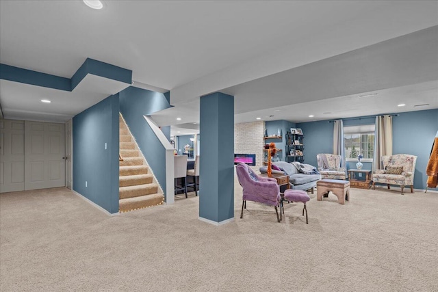 630 Polaris St, West Bend, WI 53095 - living area featuring baseboards, recessed lighting, carpet, and stairway