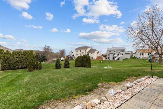 630 Polaris St, West Bend, WI 53095 - view of yard with a residential view