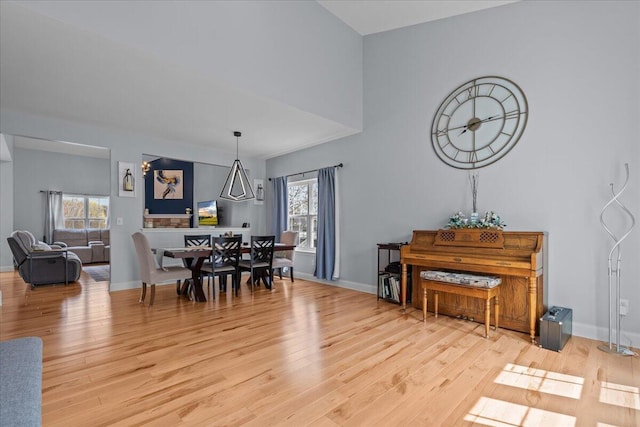 630 Polaris St, West Bend, WI 53095 - dining space with a healthy amount of sunlight, baseboards, and light wood finished floors
