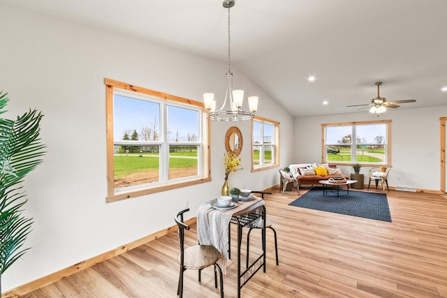dining room featuring light wood-style floors, recessed lighting, baseboards, and vaulted ceiling