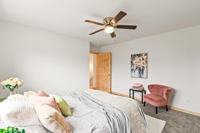 bedroom with carpet floors, a ceiling fan, and baseboards
