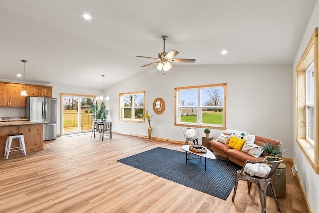 living room featuring baseboards, ceiling fan with notable chandelier, lofted ceiling, recessed lighting, and light wood-style flooring