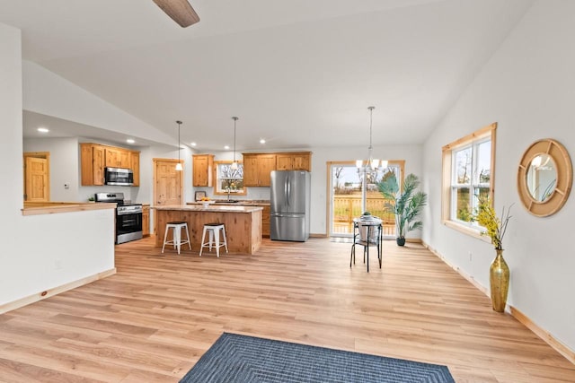 interior space with recessed lighting, vaulted ceiling, and light wood-style floors
