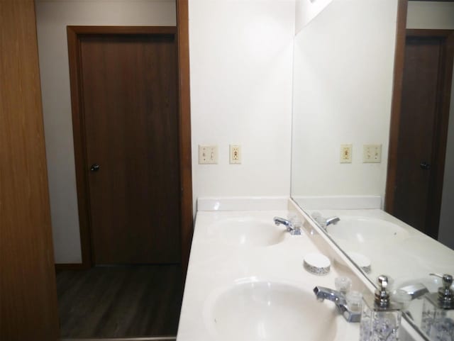 full bath with double vanity and a sink