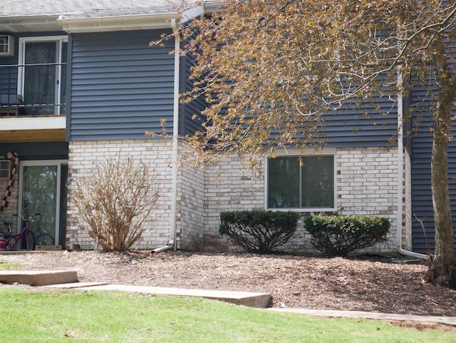 view of home's exterior featuring brick siding