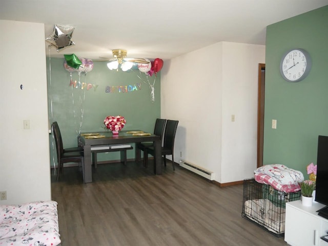 dining space with baseboards, ceiling fan, wood finished floors, and baseboard heating