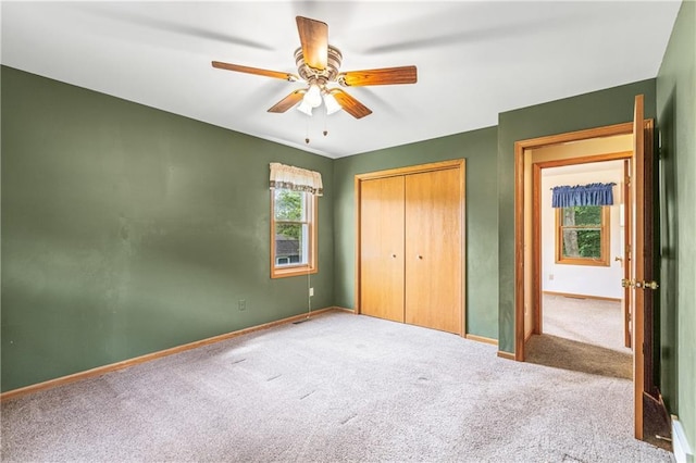 323 Hewitt St, Eau Claire, WI 54701 - unfurnished bedroom with carpet floors, baseboards, a closet, and a ceiling fan