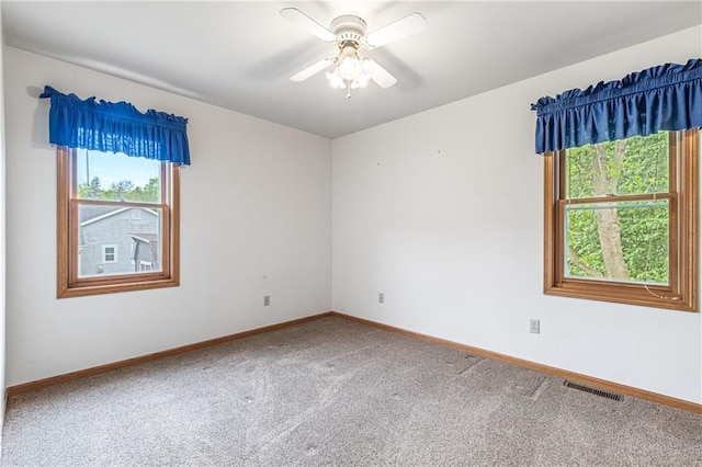 323 Hewitt St, Eau Claire, WI 54701 - unfurnished room with healthy amount of natural light, carpet floors, baseboards, and a ceiling fan