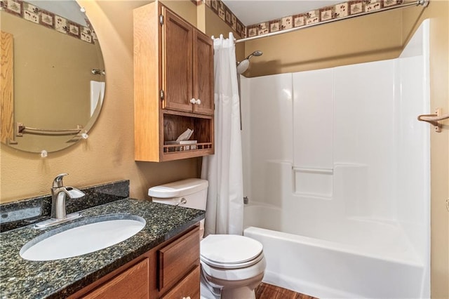 323 Hewitt St, Eau Claire, WI 54701 - bathroom featuring toilet, vanity, and shower / bath combination with curtain