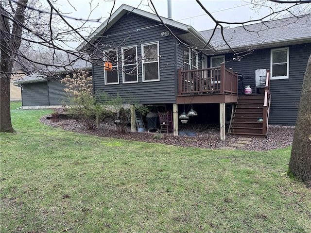 323 Hewitt St, Eau Claire, WI 54701 - rear view of house with a deck, a yard, and stairway