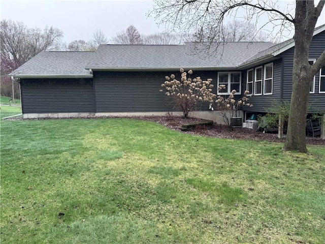 323 Hewitt St, Eau Claire, WI 54701 - back of property with a yard and a shingled roof