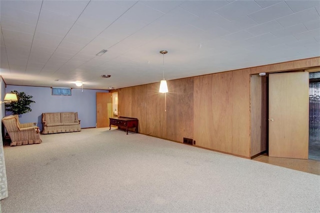 2015 Valmont Ave, Eau Claire, WI 54701 - interior space with wooden walls, visible vents, and carpet