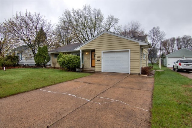 2015 Valmont Ave, Eau Claire, WI 54701 - ranch-style house featuring a garage, driveway, and a front lawn