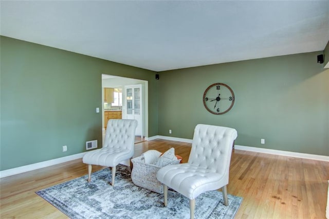 2015 Valmont Ave, Eau Claire, WI 54701 - living area featuring baseboards, visible vents, and light wood-style flooring