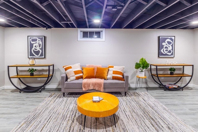 living room with baseboards and wood finished floors