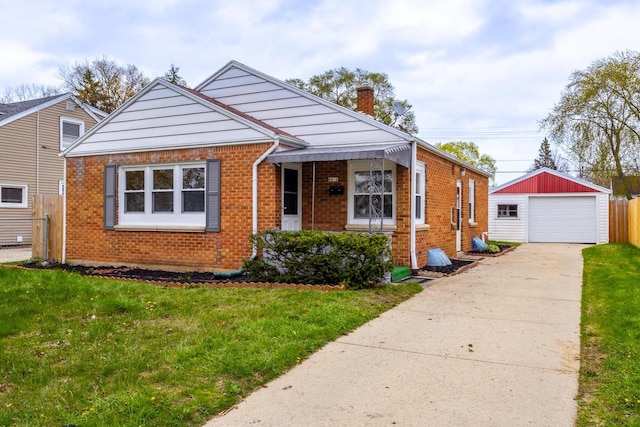 bungalow with brick siding, a chimney, a front lawn, and a garage