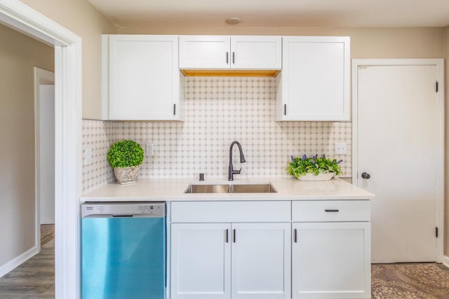 kitchen with white cabinets, a sink, dishwasher, light countertops, and tasteful backsplash