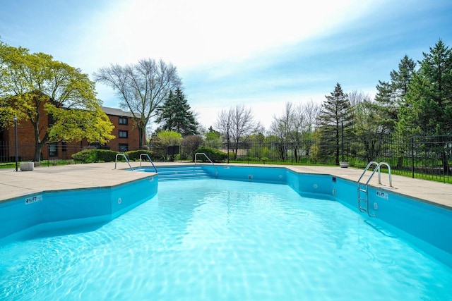 community pool featuring fence
