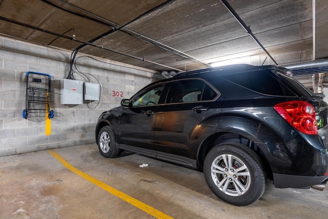 parking deck featuring concrete block wall