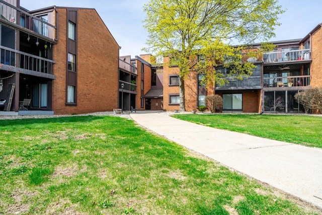 surrounding community with a yard