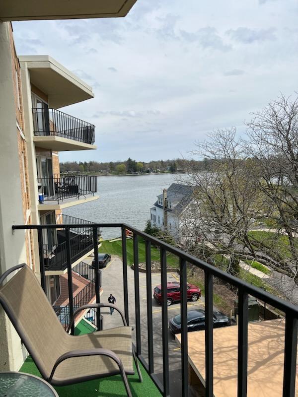 balcony featuring a water view