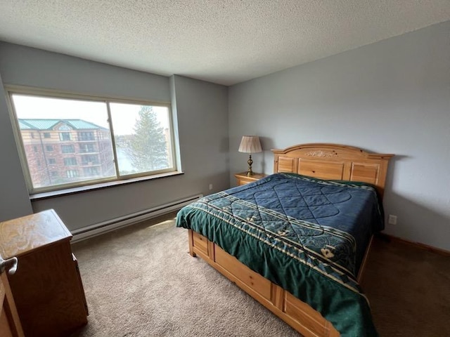 carpeted bedroom featuring a textured ceiling and baseboard heating