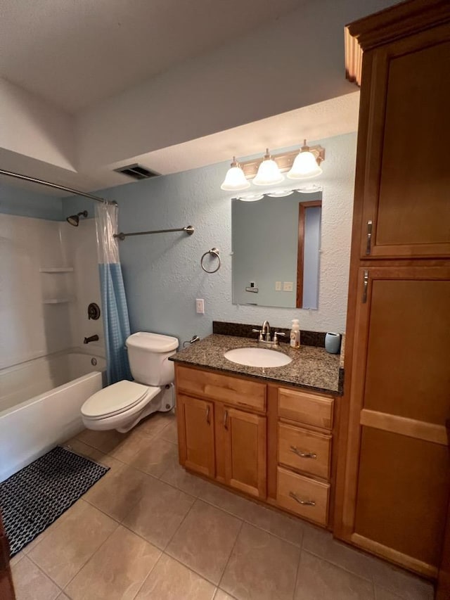 full bathroom featuring visible vents, shower / tub combo, tile patterned floors, toilet, and a textured wall