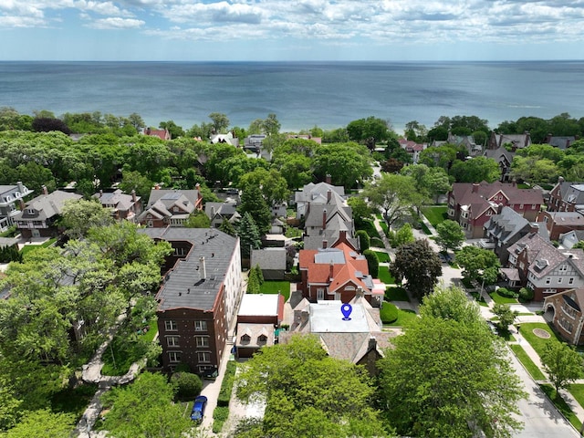 bird's eye view featuring a water view and a residential view