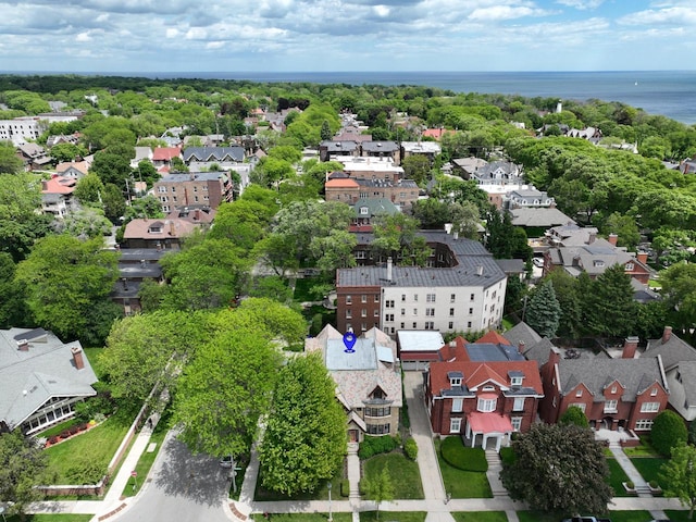 bird's eye view featuring a water view and a residential view
