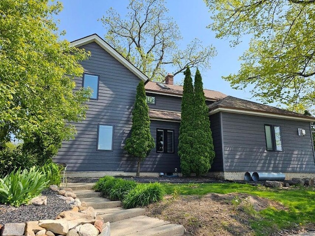 4464 S Whitnall Ave, Milwaukee, WI 53225 - rear view of house with a chimney