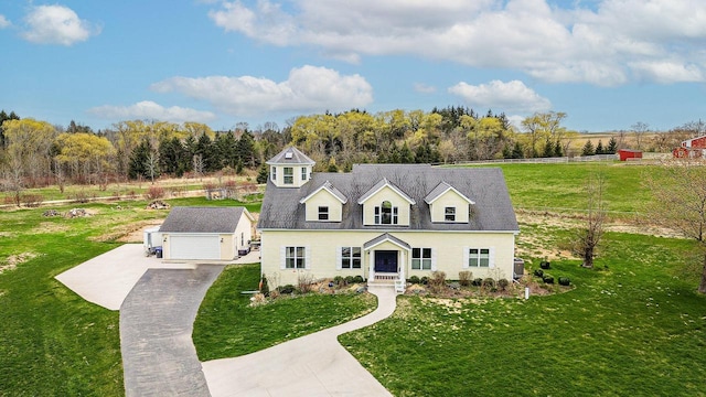 183 Twin Valley Trl, Cedar Grove, WI 53013 - cape cod home featuring a garage, a front lawn, fence, and concrete driveway