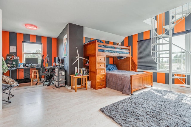 183 Twin Valley Trl, Cedar Grove, WI 53013 - bedroom with wood finished floors, an accent wall, and wallpapered walls