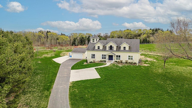 183 Twin Valley Trl, Cedar Grove, WI 53013 - cape cod house featuring concrete driveway, a garage, and a front lawn
